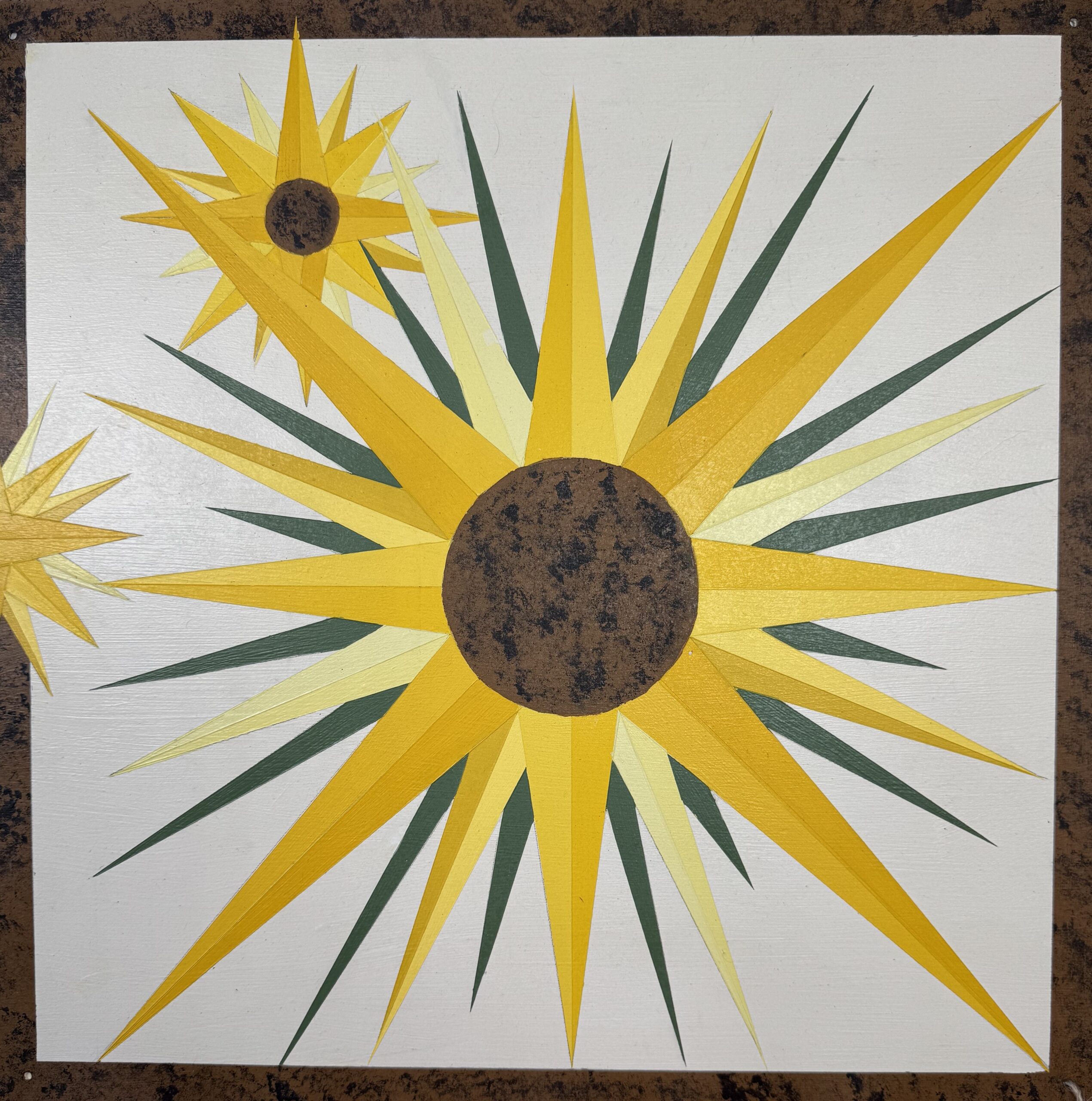 Brightly colored geometric stars radiate from dark circular centers against a white background, highlighting a vibrant artistic pattern.